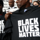 A protester holds a Black Lives Matter T-shirt during a “Hands Up, Don’t Shoot” demonstration in front of the San Francisco Hall of Justice Dec. 18, 2014, in San Francisco.
Justin Sullivan/Getty Images